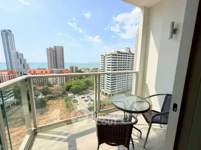 Stunning high-rise balcony with ocean view, perfect for relaxation and enjoying the cityscape.