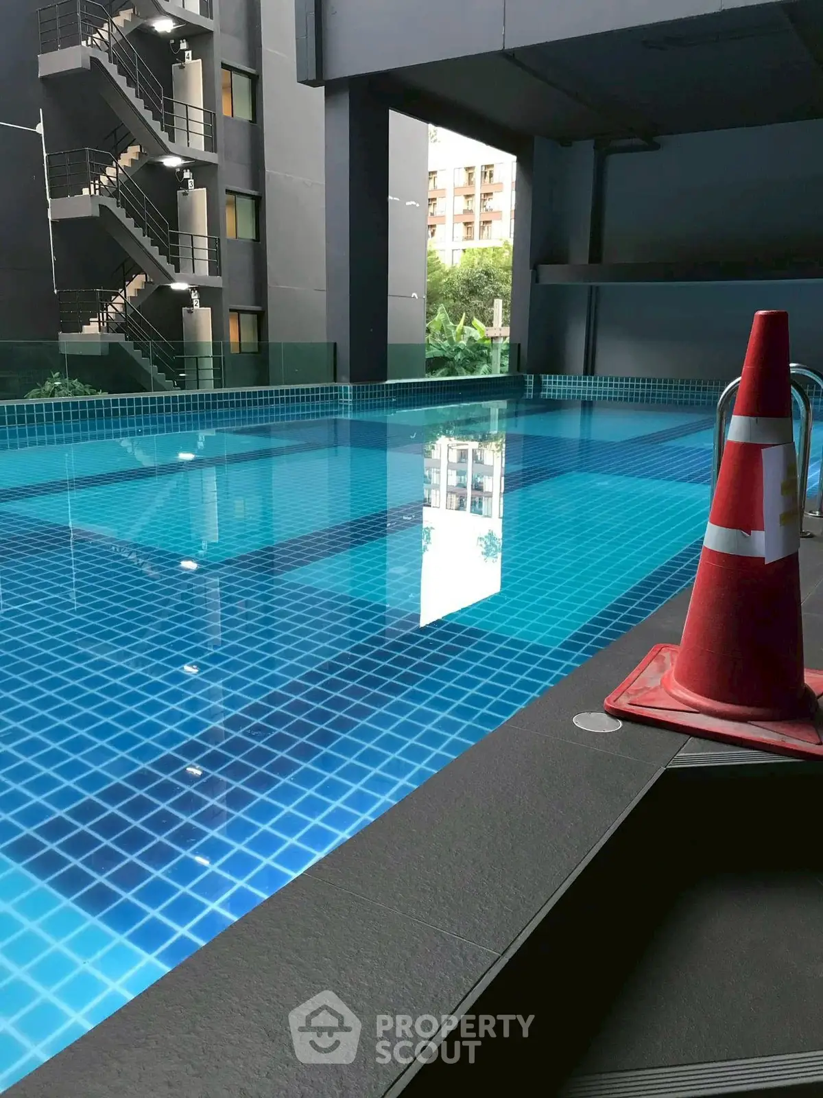 Stunning modern pool area with sleek design and city views, perfect for relaxation and leisure.