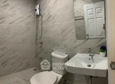 Modern bathroom with sleek tiles and contemporary fixtures