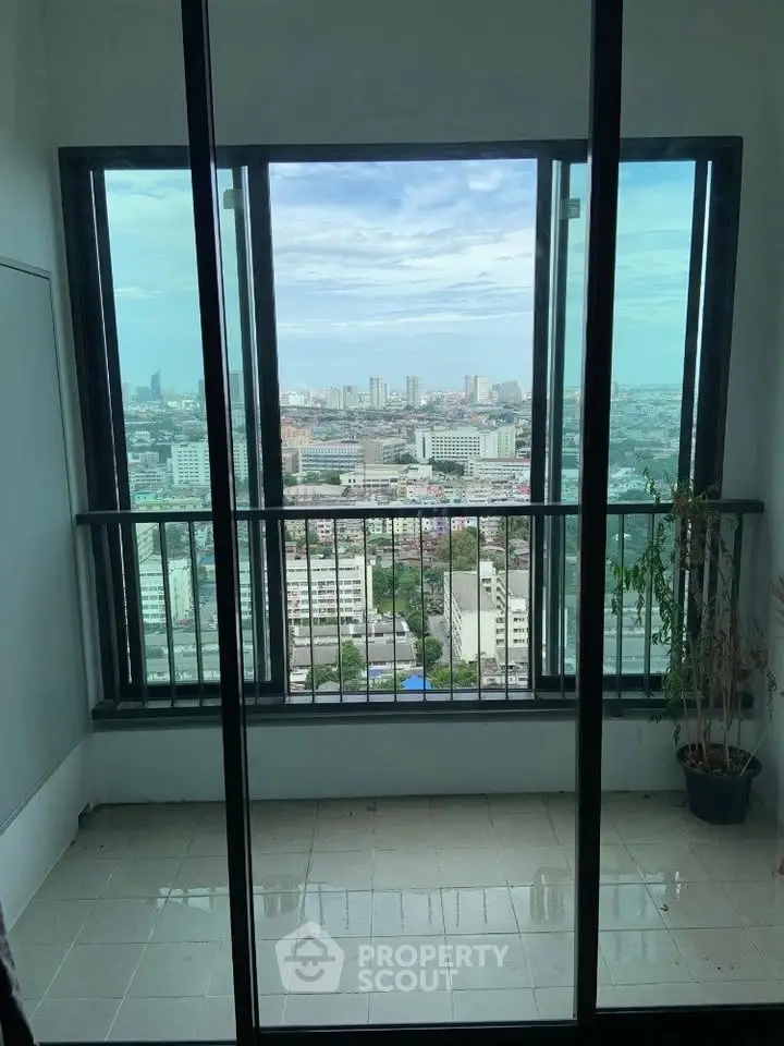 Stunning cityscape view from a high-rise balcony, perfect for urban living enthusiasts.