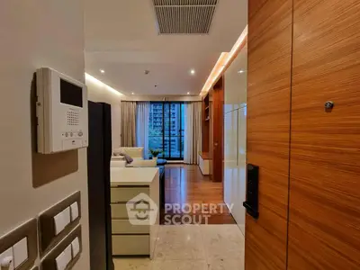 Modern apartment entrance with open living room and sleek design