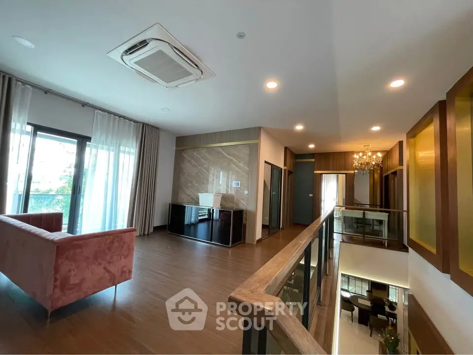 Spacious modern living room with elegant decor and large windows for natural light.