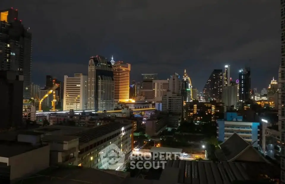 Stunning nighttime cityscape view showcasing vibrant urban skyline with illuminated skyscrapers.