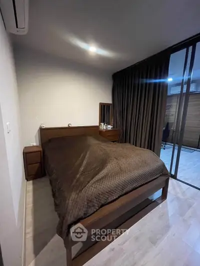 Cozy bedroom with modern design and wooden furniture, featuring a comfortable bed and stylish decor.