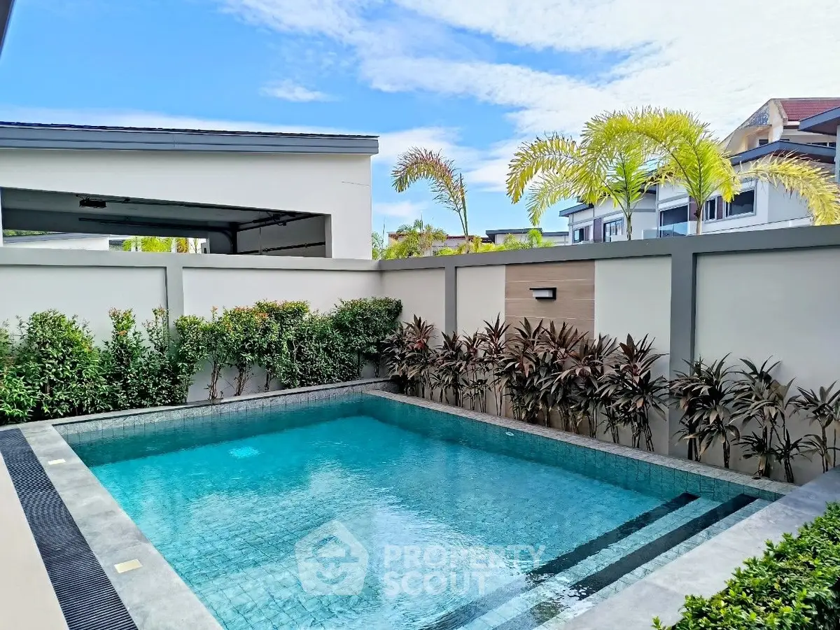 Luxurious private pool with lush greenery in modern residential setting