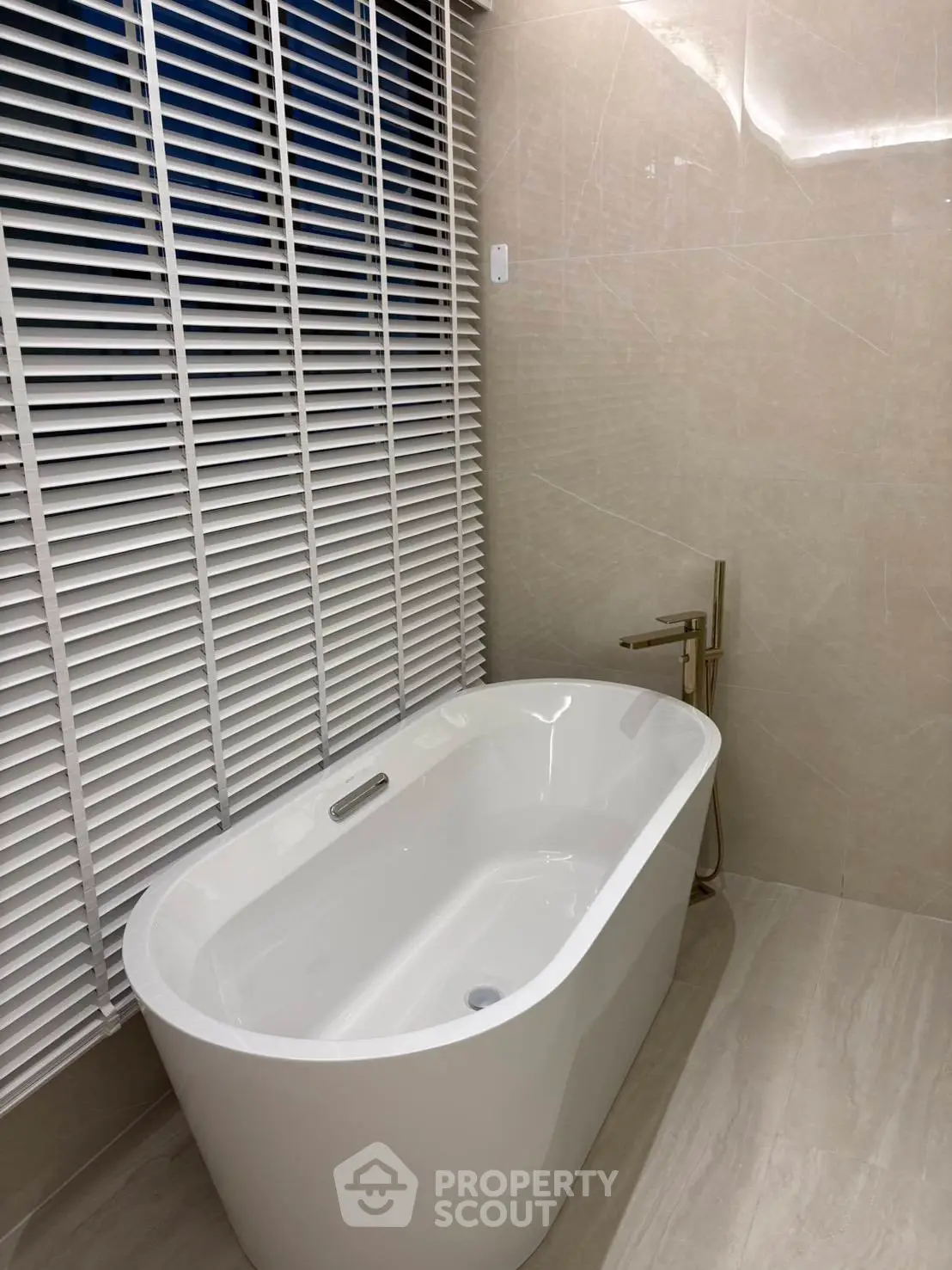 Luxurious bathroom with elegant freestanding bathtub and modern fixtures