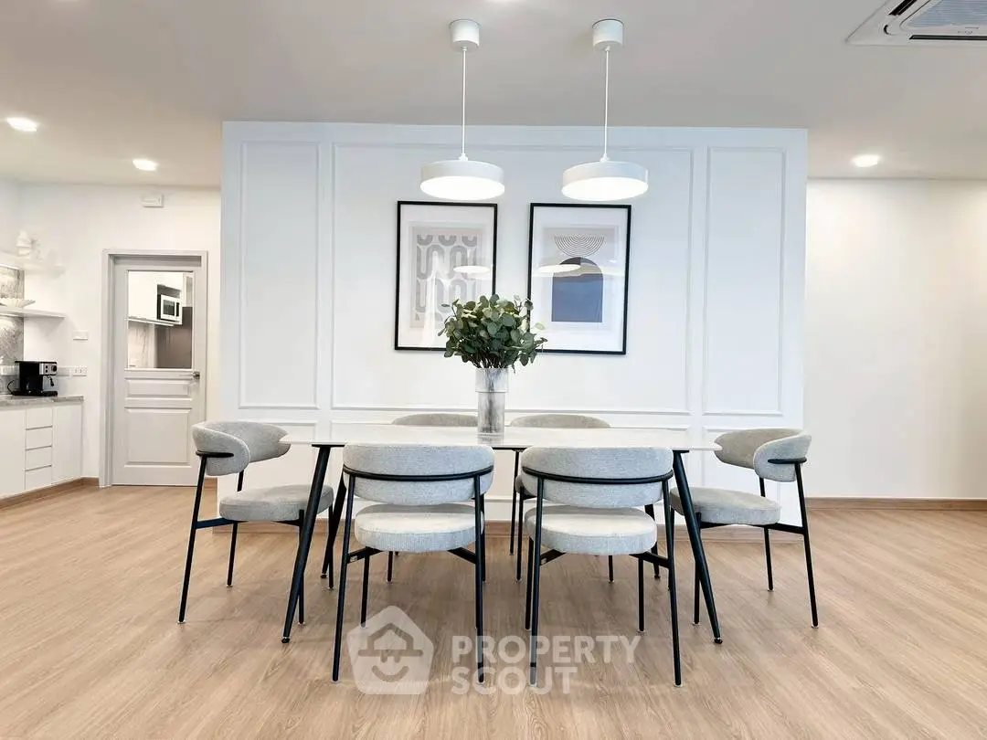 Modern dining room with elegant decor and stylish lighting in a contemporary home.