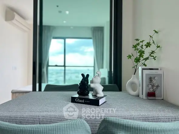 Modern interior with stylish decor and large window view