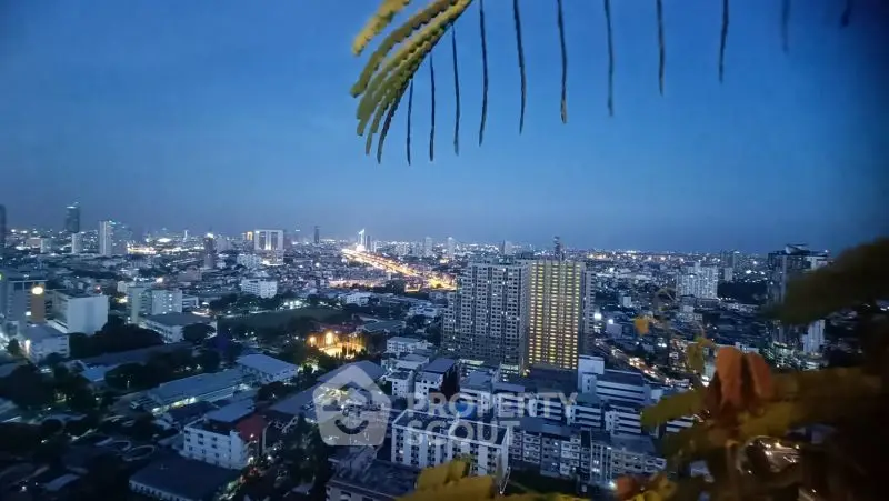 Stunning cityscape view from high-rise apartment at dusk, showcasing vibrant urban skyline.