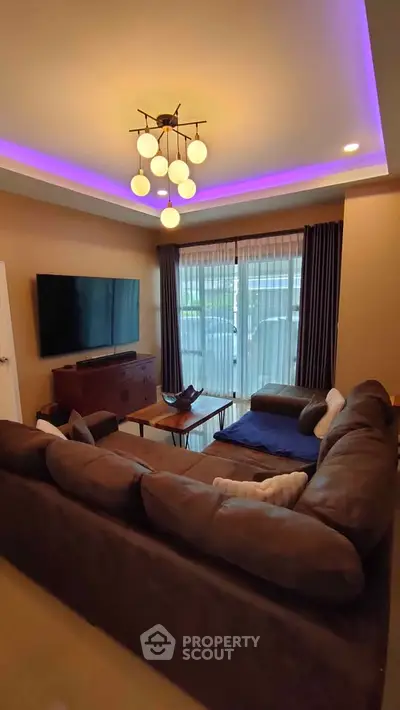 Modern living room with stylish lighting and cozy sectional sofa