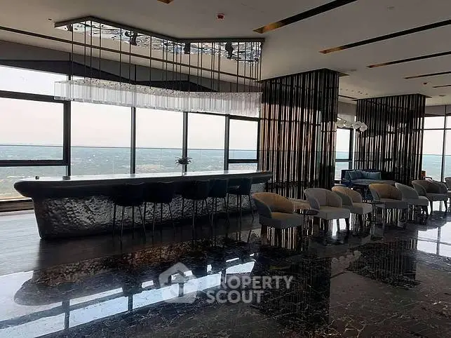 Luxurious modern living room with panoramic views and sleek interior design.