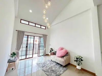 Bright and airy living room with modern decor and large windows for natural light.