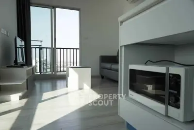 Modern living room with balcony view and sleek interior design