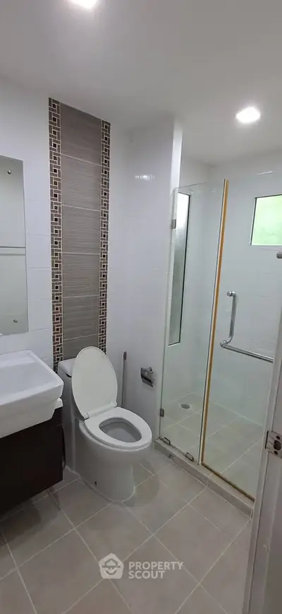 Modern bathroom with sleek design and glass shower enclosure