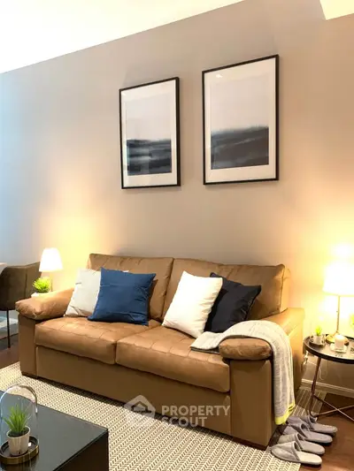 Cozy living room with stylish decor and comfortable brown sofa