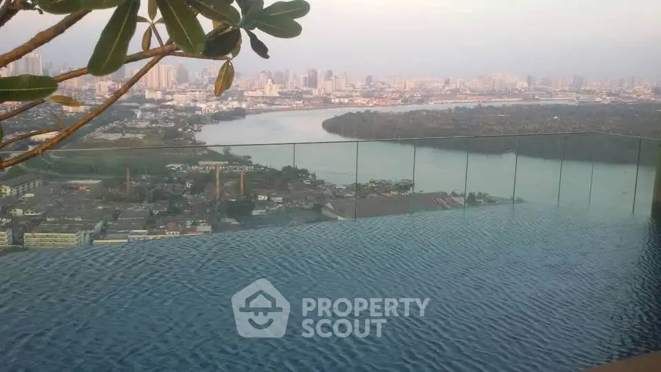Stunning infinity pool with panoramic city skyline view, perfect for luxury living.