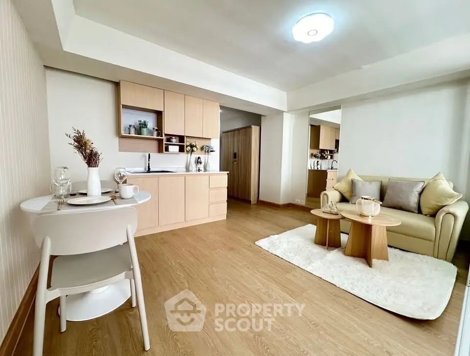 Modern living room with open kitchen and stylish decor