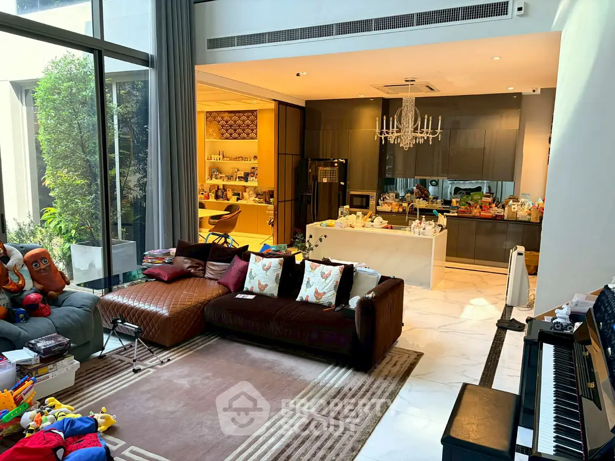 Luxurious open-plan living room with modern kitchen and elegant decor