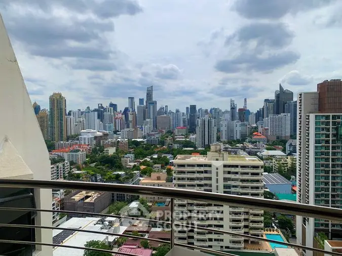 Captivating cityscape view from a high-rise balcony, showcasing a sprawling urban skyline with lush greenery, ideal for metropolitan living.