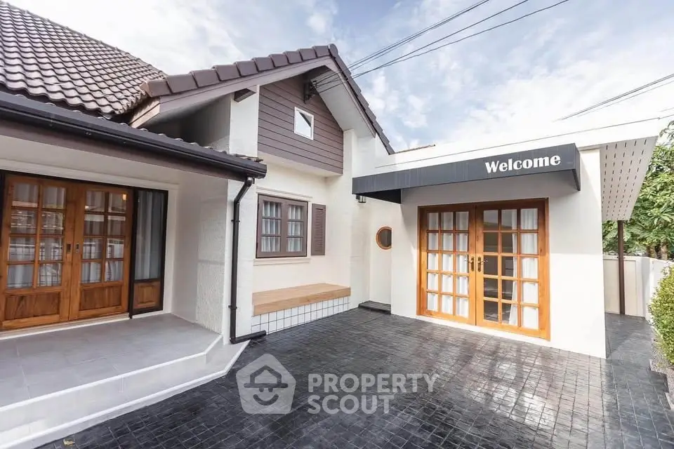 Charming modern house exterior with welcoming entrance and stylish design.
