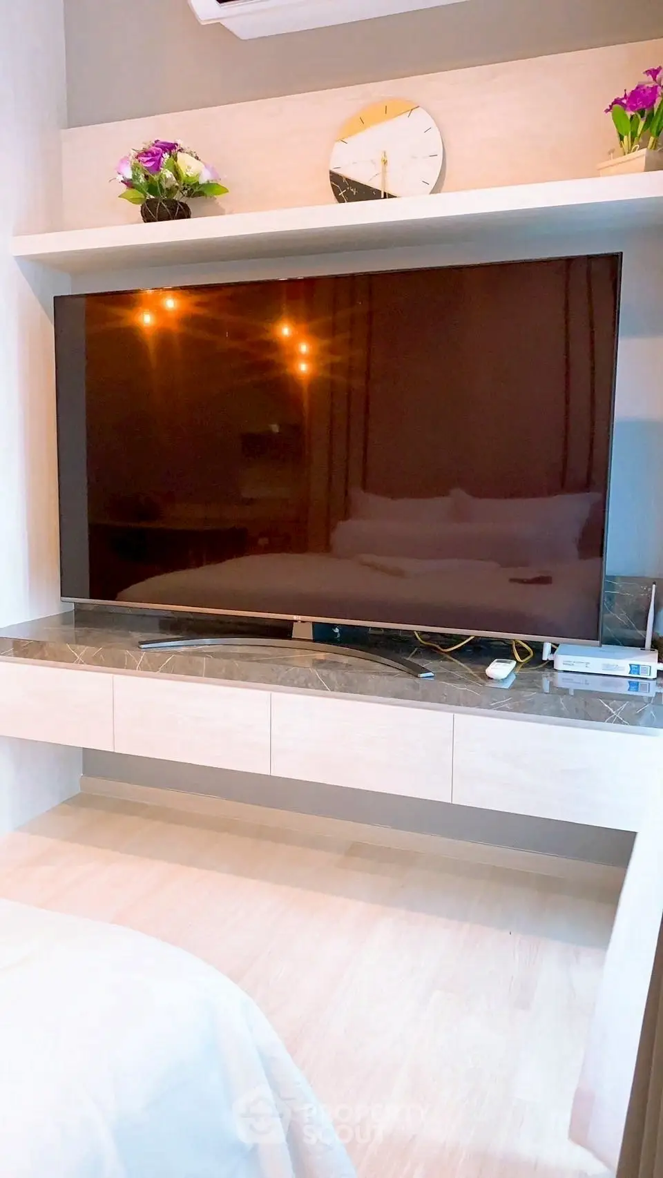 Modern living room with sleek TV setup and stylish decor