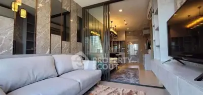 Luxurious modern living room with elegant decor and spacious layout, featuring a plush sofa and stylish lighting.