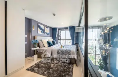 Modern bedroom with city view, stylish decor, and floor-to-ceiling windows.