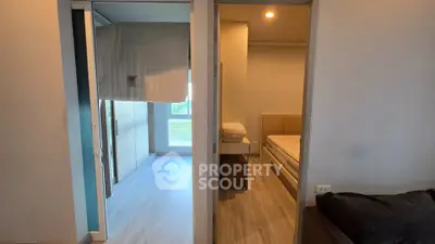 Modern apartment interior with two bedrooms featuring sleek design and natural light.