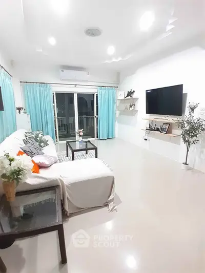 Bright and airy living room with modern decor and large windows.