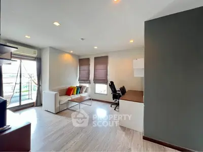 Spacious modern living room with natural light and stylish decor