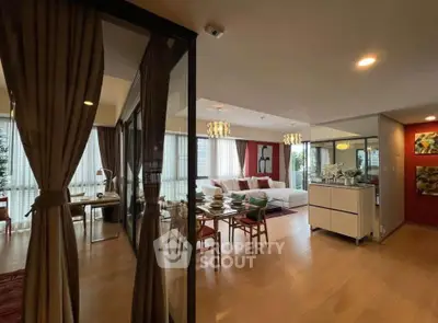 Spacious modern living room with elegant dining area and floor-to-ceiling windows.