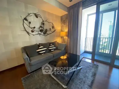 Stylish living room with modern decor and balcony view in luxury apartment.