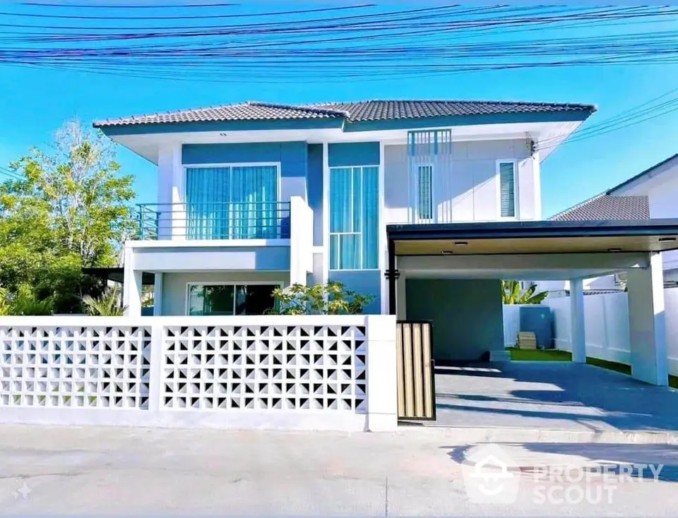 Modern two-story house with spacious driveway and stylish facade