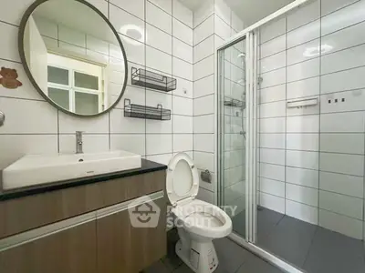 Modern bathroom with sleek design and glass shower enclosure