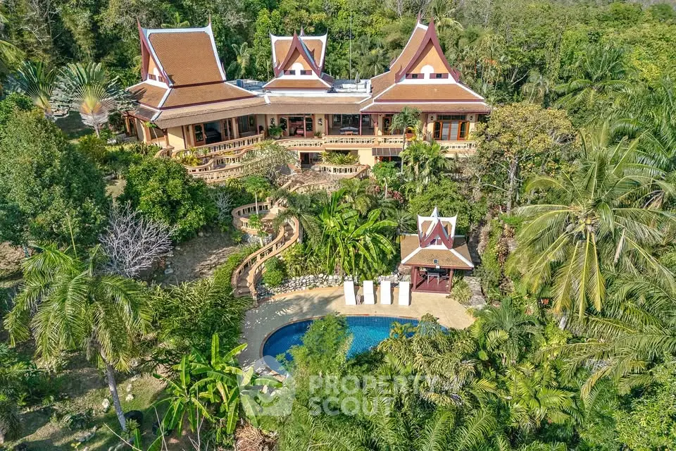 Stunning tropical villa with lush gardens and private pool, offering serene luxury living in a unique architectural design.