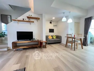 Modern living room with stylish wooden furniture and open layout, perfect for cozy gatherings.