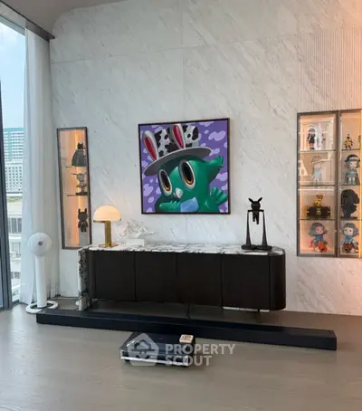 Stylish living room with modern art and elegant decor in a high-rise apartment.
