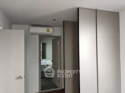 Modern apartment interior with air conditioning and bathroom view