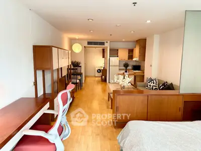 Spacious open-plan living area with modern furniture and wooden flooring