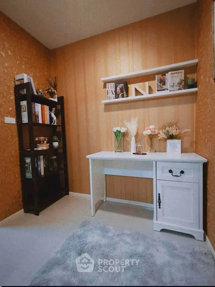 Charming study room with stylish decor and cozy ambiance, perfect for work or relaxation.