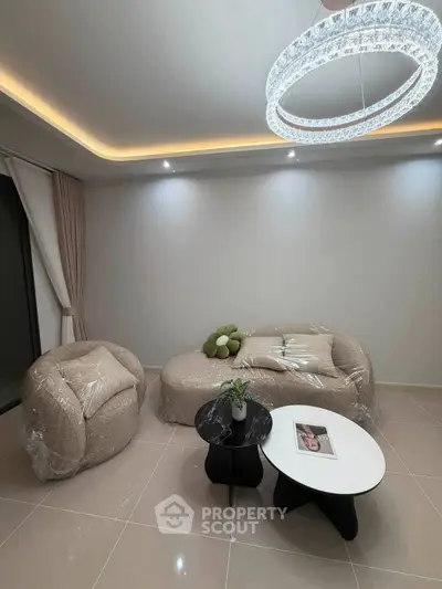 Modern living room with stylish furniture and elegant lighting