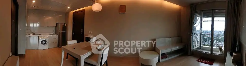 Modern apartment interior with open kitchen and balcony view