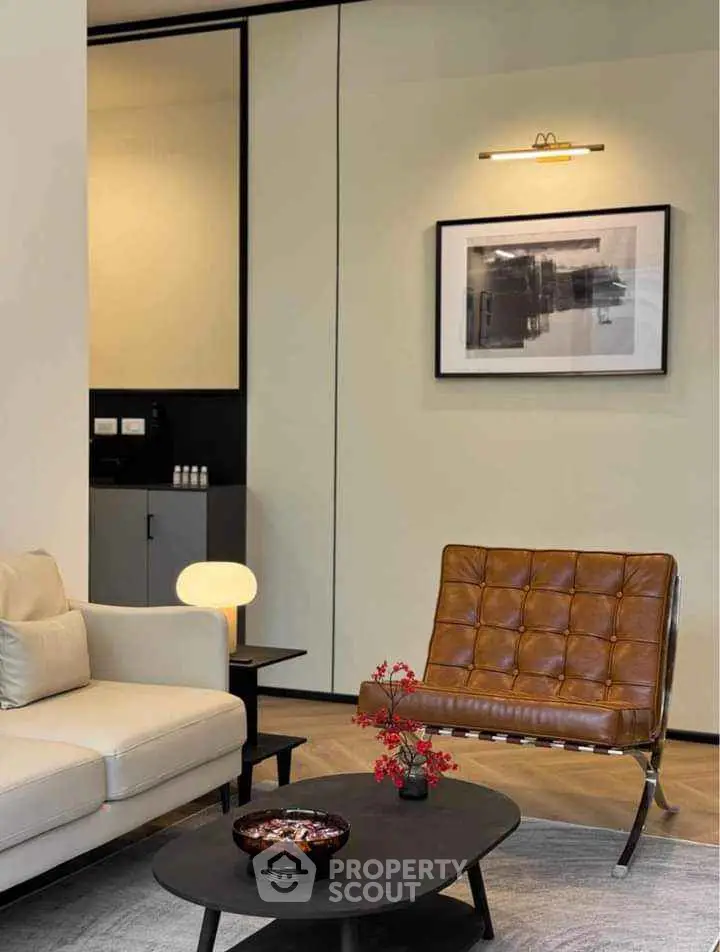 Modern living room with stylish furniture and contemporary art