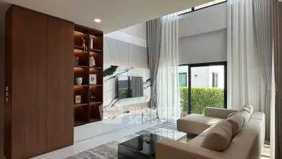 Luxurious modern living room with high ceilings and elegant decor