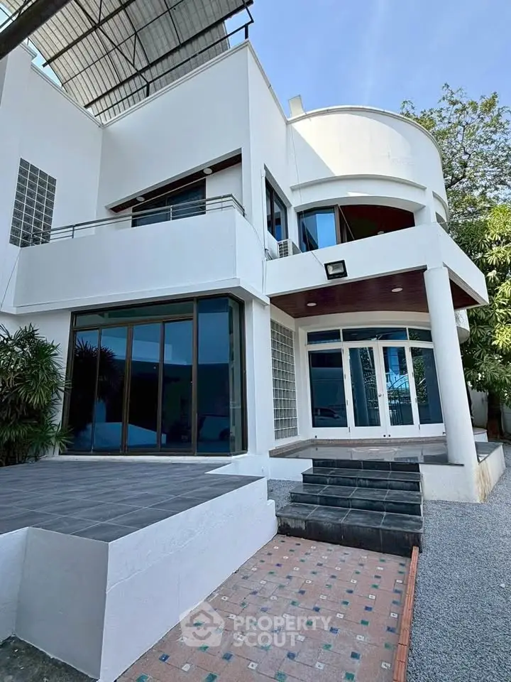 Modern architectural home with sleek design and spacious outdoor area, perfect for luxury living.