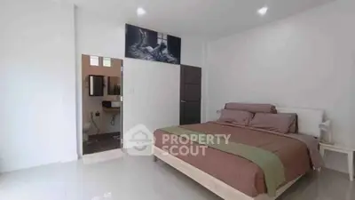 Spacious bedroom with ensuite bathroom and modern decor
