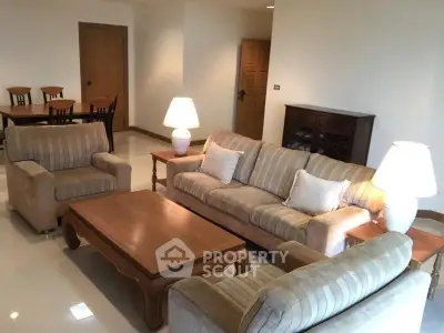 Spacious living room with elegant furniture and warm lighting