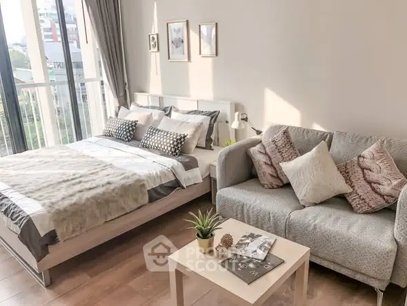 Cozy bedroom with stylish decor and natural light