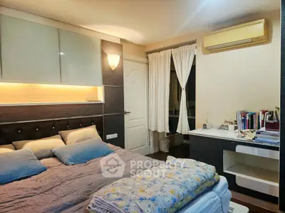 Cozy bedroom with modern decor and workspace