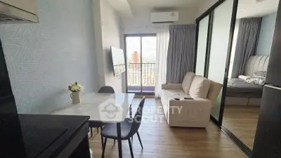 Modern apartment interior with cozy living room and bedroom, featuring a balcony with city view.